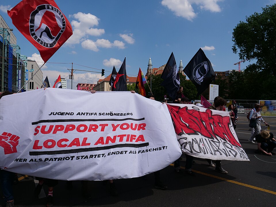 Antifa flags displayed at a public demonstration.